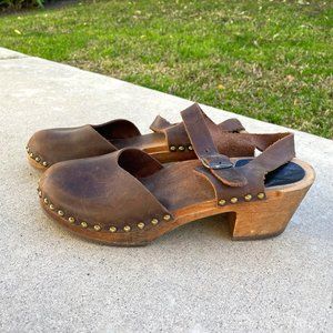 Monochrome brown wooden clogs - brass rivets